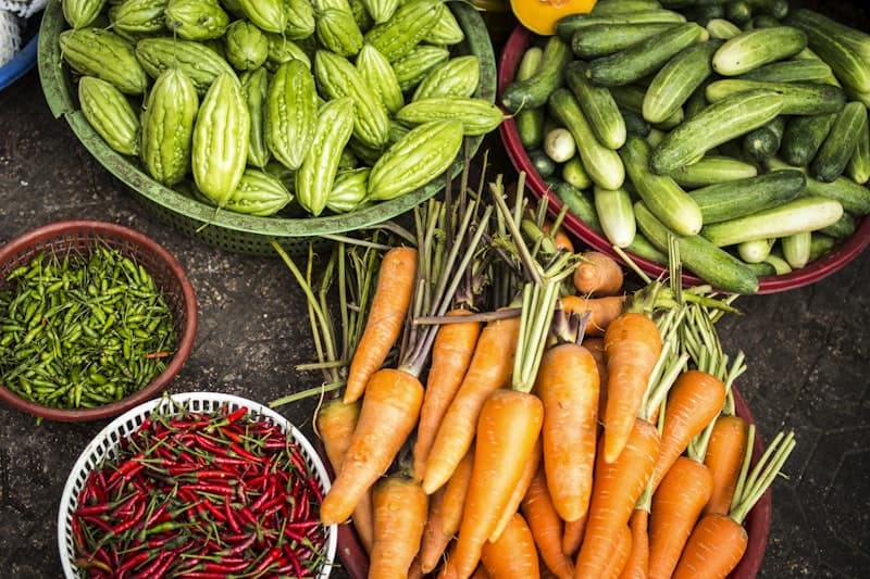Lush garden rows with vegetables growing in golden sunlight